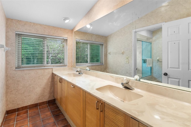 bathroom with vanity, a shower with door, and tile patterned floors