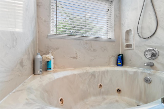 bathroom featuring a tub