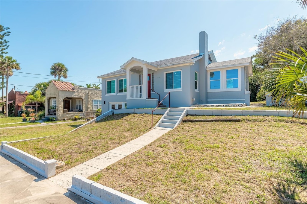 408 Wisteria Rd, Daytona Beach, FL 32118 - view of front of property with a front lawn