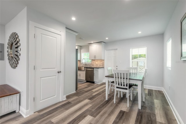 408 Wisteria Rd, Daytona Beach, FL 32118 - dining space featuring dark hardwood / wood-style floors and a wealth of natural light