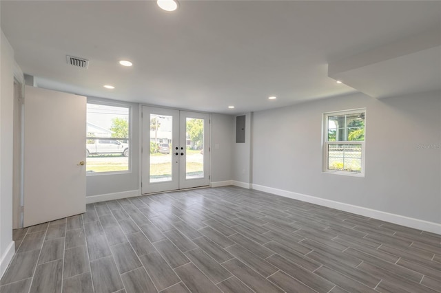 408 Wisteria Rd, Daytona Beach, FL 32118 - empty room with electric panel and french doors
