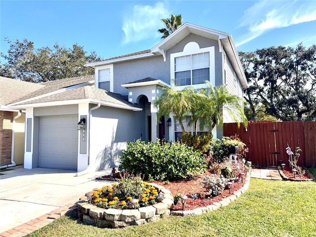 view of front of home featuring a garage and a front yard