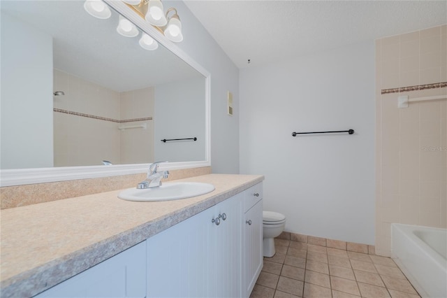 bathroom featuring vanity, tile patterned floors, and toilet