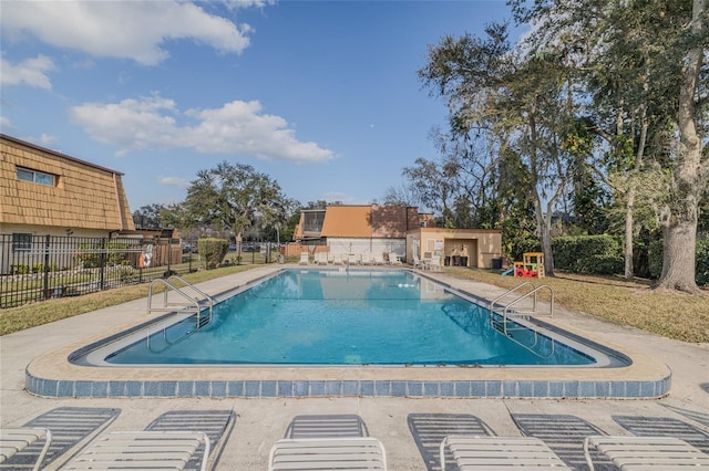 view of swimming pool with a patio