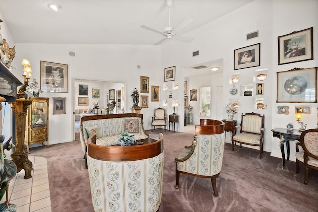 living room featuring ceiling fan, carpet floors, and high vaulted ceiling