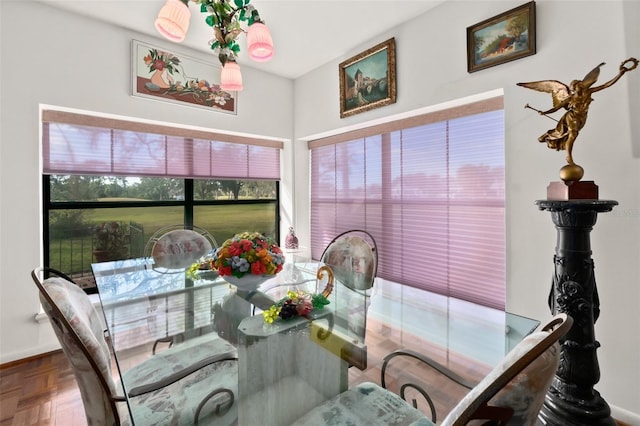 dining area with parquet floors