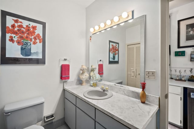 bathroom with vanity and toilet