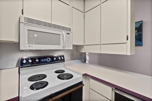 kitchen featuring white cabinetry, backsplash, dishwashing machine, and electric range