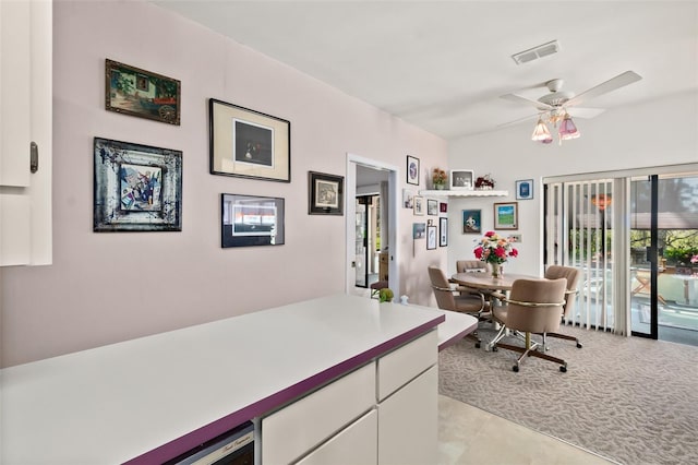 office featuring ceiling fan and light colored carpet