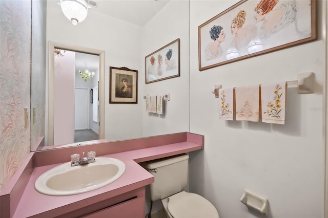 bathroom with vanity and toilet