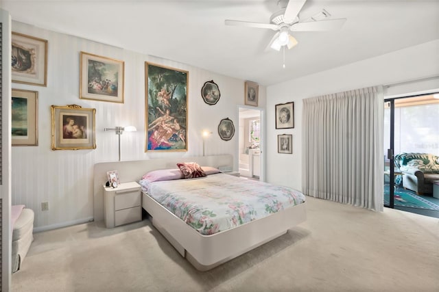 carpeted bedroom featuring access to outside and ceiling fan