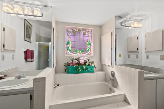 bathroom with vanity and a tub