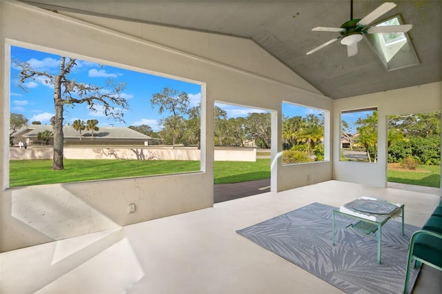 sunroom / solarium with vaulted ceiling and ceiling fan