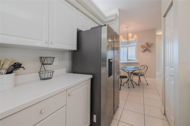 kitchen featuring light tile patterned flooring, white cabinetry, decorative light fixtures, a chandelier, and stainless steel fridge with ice dispenser