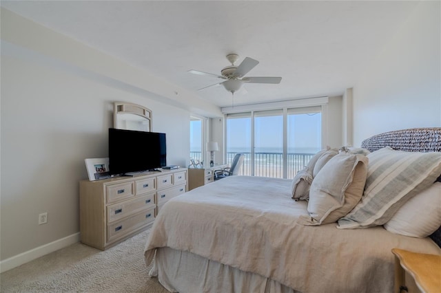 bedroom featuring ceiling fan, light carpet, and access to outside