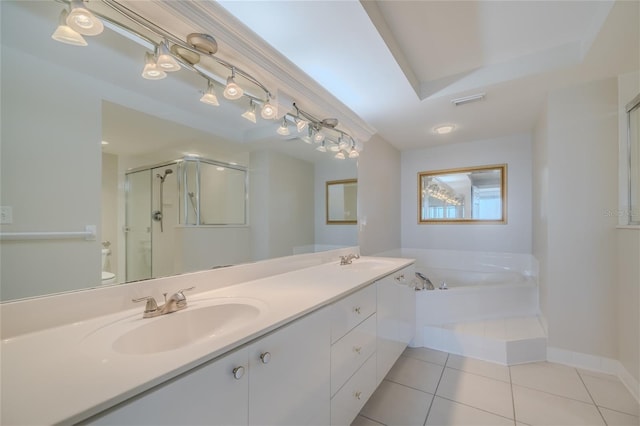 full bathroom with vanity, tile patterned floors, independent shower and bath, and toilet