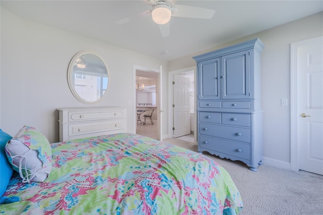 bedroom featuring light carpet and ceiling fan