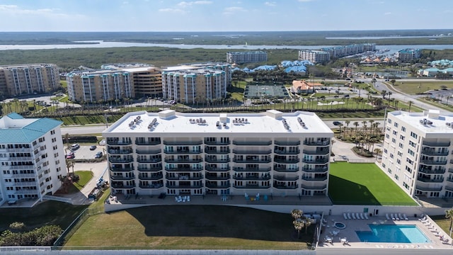 birds eye view of property with a water view