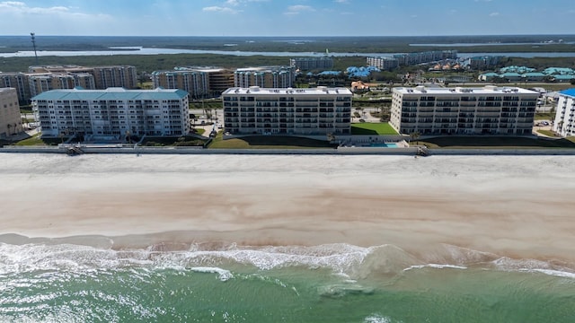 aerial view featuring a view of the beach and a water view