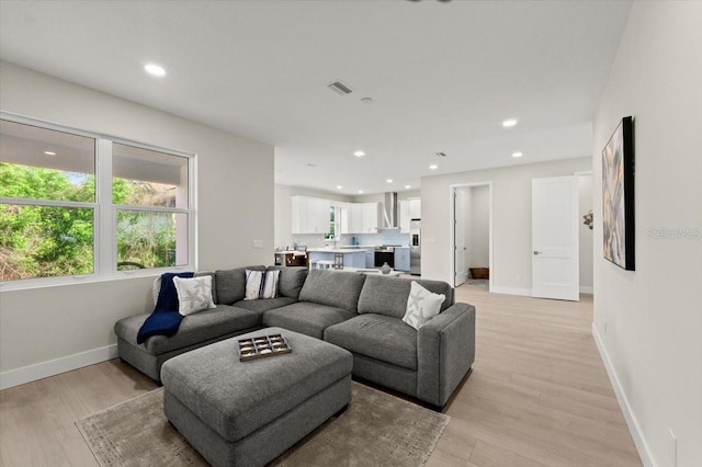 living room with light hardwood / wood-style flooring