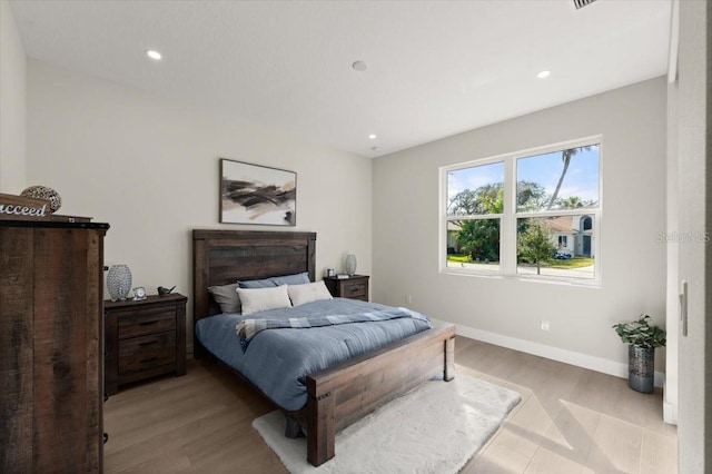 bedroom with light hardwood / wood-style flooring