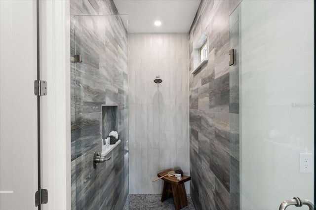 bathroom featuring a tile shower