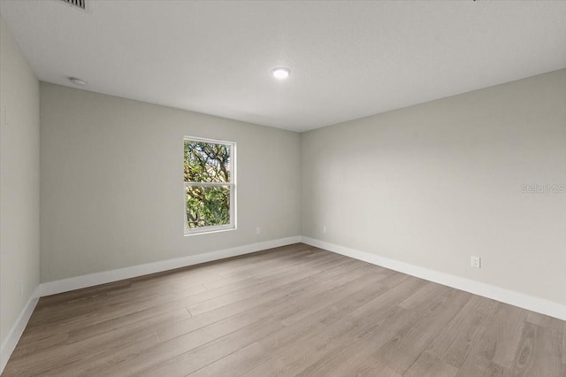 unfurnished room featuring light wood-type flooring