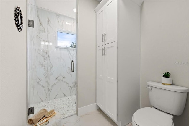 bathroom with a shower with door and toilet