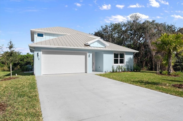 view of front of house with a garage and a front lawn