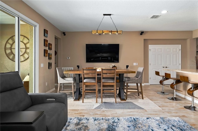 dining room featuring light wood-type flooring