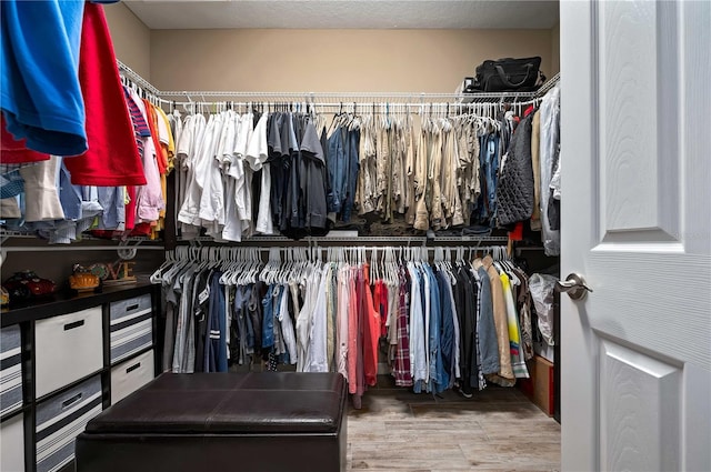 walk in closet featuring hardwood / wood-style floors