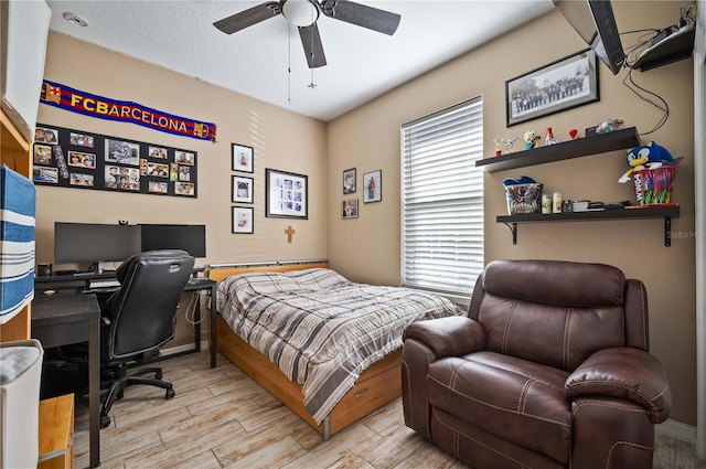 bedroom featuring light hardwood / wood-style floors and ceiling fan