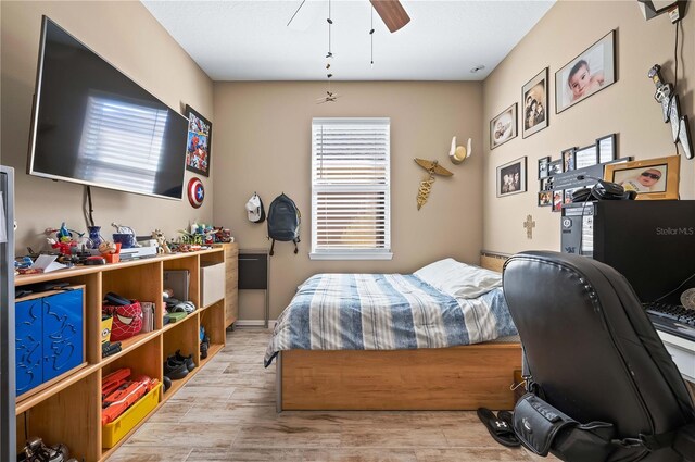 bedroom featuring ceiling fan and light wood-type flooring