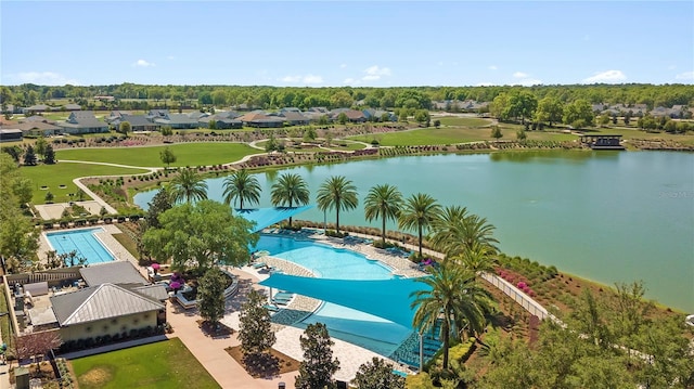 birds eye view of property with a water view