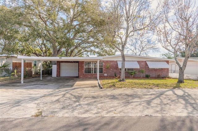 single story home featuring a garage and a front yard