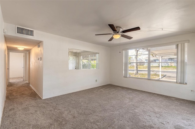 unfurnished room featuring carpet floors and ceiling fan