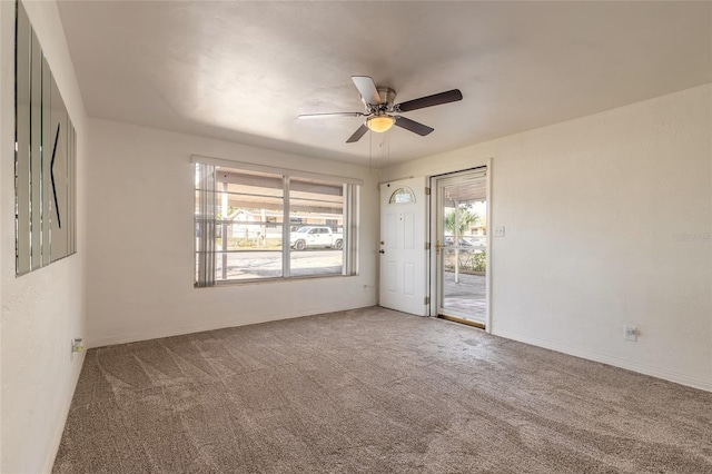 carpeted empty room with ceiling fan