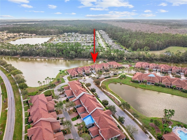 birds eye view of property featuring a water view