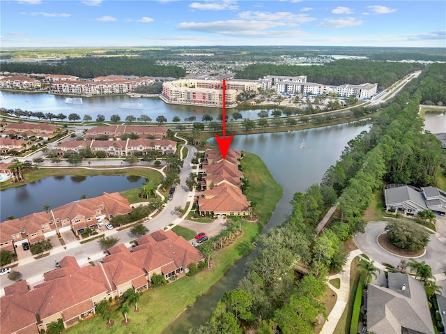 birds eye view of property with a water view