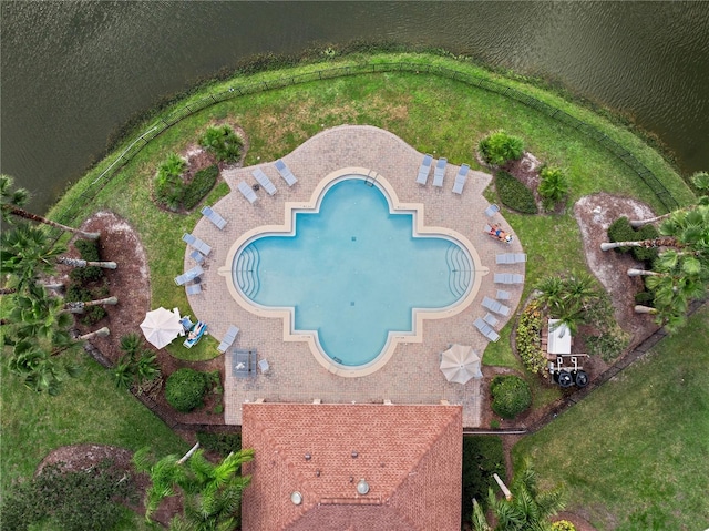 view of pool with a water view