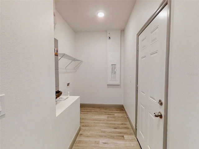 interior space with baseboards and wood finished floors