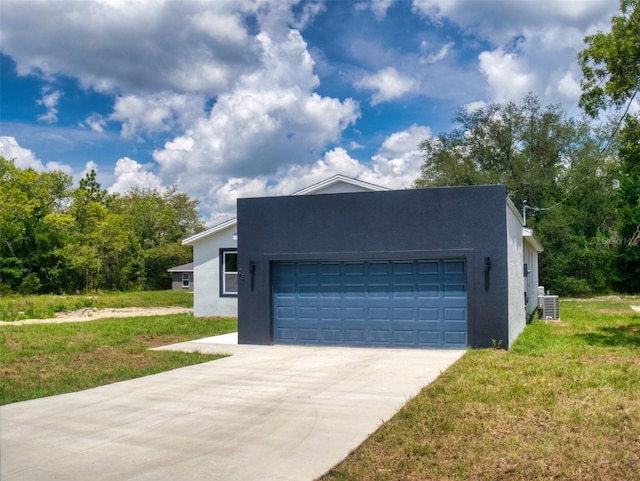 exterior space featuring concrete driveway, a lawn, a garage, and stucco siding