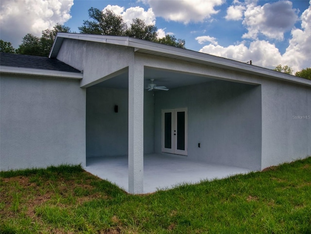 rear view of property with a patio, french doors, a ceiling fan, and stucco siding