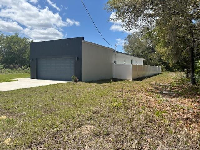 exterior space featuring driveway and fence