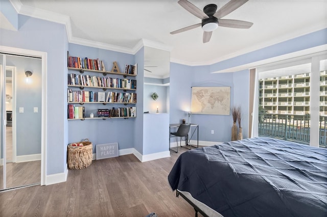 bedroom with hardwood / wood-style flooring, ceiling fan, ornamental molding, and access to exterior