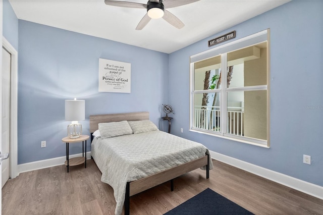 bedroom featuring hardwood / wood-style flooring and ceiling fan