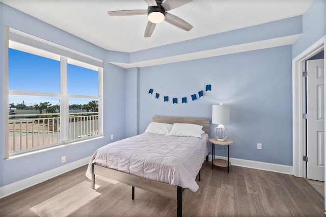 bedroom with hardwood / wood-style floors and ceiling fan