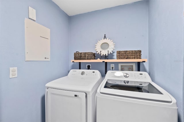 washroom featuring washer and clothes dryer