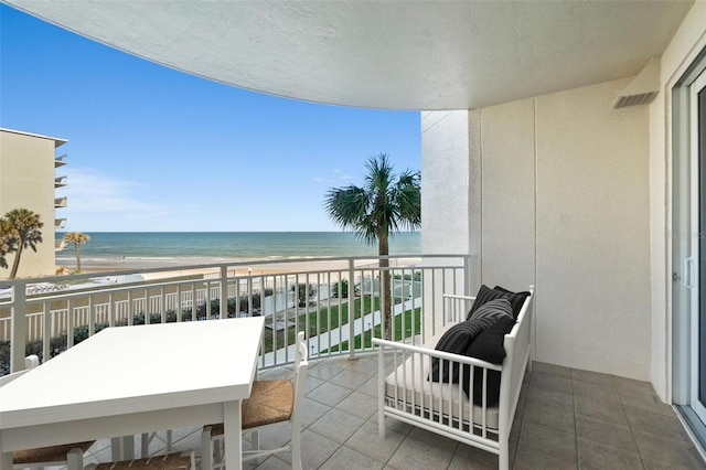 balcony with a view of the beach and a water view