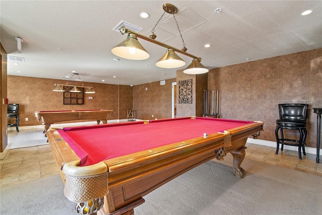 playroom with pool table and a textured ceiling